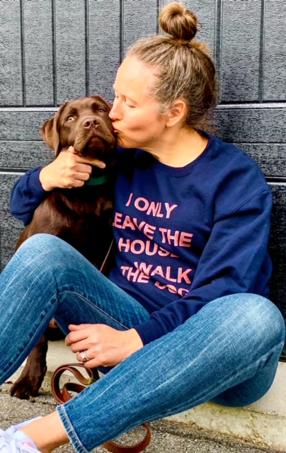 A woman sitting with her dog